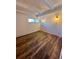 Bright bedroom featuring wood-look floors and a window at 2401 S Gaylord St # 103, Denver, CO 80210