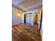 Spacious bedroom with wood-look floors and large closet at 2401 S Gaylord St # 103, Denver, CO 80210