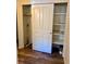 Shelved closet with sliding doors and rod at 2401 S Gaylord St # 103, Denver, CO 80210