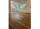 Living room with wood-look floors and a view at 2401 S Gaylord St # 103, Denver, CO 80210