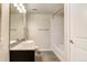 Clean bathroom with a bathtub, shower, and granite vanity at 4100 Albion St # 504, Denver, CO 80216