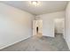 Bright bedroom with carpeted floors and access to a walk-in closet at 4100 Albion St # 504, Denver, CO 80216