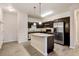 Modern kitchen with island and stainless steel appliances at 4100 Albion St # 504, Denver, CO 80216