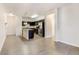 Modern kitchen with island and open living area at 4100 Albion St # 504, Denver, CO 80216