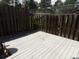 Backyard deck bordered by a tall, dark wooden fence at 453 S Kittredge St # D, Aurora, CO 80017