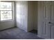 Bedroom with natural light and a gray carpet with white doors at 453 S Kittredge St # D, Aurora, CO 80017