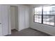 Light-filled bedroom with neutral walls, closet space, and a large window for natural light at 453 S Kittredge St # D, Aurora, CO 80017