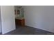 Bedroom featuring gray carpets leading to a bathroom vanity with wooden cabinets at 453 S Kittredge St # D, Aurora, CO 80017