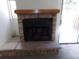 A cozy stone fireplace with a wooden mantle, perfect for warming up any living space at 453 S Kittredge St # D, Aurora, CO 80017
