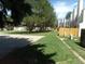 Landscaped community street view highlighting well-maintained lawns and mature trees at 453 S Kittredge St # D, Aurora, CO 80017