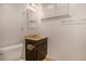 Well-lit bathroom featuring a vanity, mirror, and tiled shower, creating a functional and clean space at 3273 S Florence Ct, Denver, CO 80231