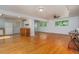 Open-concept living area with hardwood floors and natural light; a great space for entertaining and relaxation at 3273 S Florence Ct, Denver, CO 80231