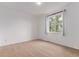 This bedroom features carpet and a window that provides natural light at 12825 Forest Way, Thornton, CO 80241