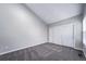 Bedroom with neutral walls, carpet, vaulted ceiling and closet doors for optimal storage space at 4825 S Ammons St # 102, Littleton, CO 80123