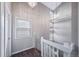 Upstairs hallway features elegant lighting and bright natural light at 4825 S Ammons St # 102, Littleton, CO 80123