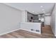 Modern kitchen features stainless steel appliances, gray cabinets, and breakfast bar for casual dining at 4825 S Ammons St # 102, Littleton, CO 80123