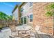 Cozy patio area with seating, providing a great space for outdoor dining or relaxation at 4825 S Ammons St # 102, Littleton, CO 80123
