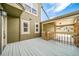 Spacious outdoor patio area perfect for relaxing and entertaining with wood deck and natural light at 4825 S Ammons St # 102, Littleton, CO 80123