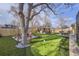 Backyard features a golf putting green, outdoor seating, and gazebo seating area at 11964 W 71St Pl, Arvada, CO 80004