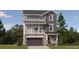 Two-story home with gray siding, stone accents, and a two-car garage at 2080 S Haleyville Way, Aurora, CO 80018