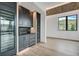 Bar area with wine refrigerators, sink, dark cabinetry, and wood accent ceiling at 294 Gold Run Rd, Breckenridge, CO 80424