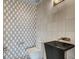 Powder room with modern geometric wallpaper, black vessel sink, and white tile at 294 Gold Run Rd, Breckenridge, CO 80424