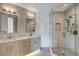 Modern bathroom with double sinks, a glass shower, and neutral tile, creating a serene atmosphere at 294 Gold Run Rd, Breckenridge, CO 80424