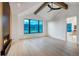 Serene bedroom featuring a modern fireplace, vaulted ceilings, and a large window framing picturesque outdoor scenery at 294 Gold Run Rd, Breckenridge, CO 80424