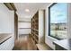 Walk-in closet featuring custom shelving, natural light from a window, and scenic outdoor views at 294 Gold Run Rd, Breckenridge, CO 80424