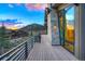 Deck overlooking landscaped grounds with stunning views and black metal railings at 294 Gold Run Rd, Breckenridge, CO 80424