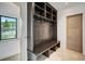 Inviting entryway featuring a built-in bench with storage and coat hooks, offering a practical and stylish welcome at 294 Gold Run Rd, Breckenridge, CO 80424