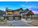 Modern home with a 3 car garage, beautiful exterior, and covered entryway at 294 Gold Run Rd, Breckenridge, CO 80424