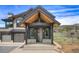 Inviting front entrance with a stone walkway and modern architectural details at 294 Gold Run Rd, Breckenridge, CO 80424