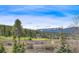 Picturesque view of lush golf course and mountain scenery in the community at 294 Gold Run Rd, Breckenridge, CO 80424