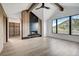 Bright living room featuring a modern fireplace, wood beams, and a large window with mountain views at 294 Gold Run Rd, Breckenridge, CO 80424