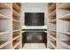 Walk-in pantry with custom shelving and dark cabinets at 294 Gold Run Rd, Breckenridge, CO 80424