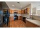 Efficient kitchen with wood cabinets and appliances, perfect for everyday cooking and entertaining at 74 Whitehaven Cir, Highlands Ranch, CO 80129