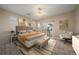 Serene primary bedroom with calm colors, large windows, and lots of space to relax at 74 Whitehaven Cir, Highlands Ranch, CO 80129