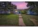 Charming home with a well-manicured lawn, inviting walkway, and a striking blue front door at 2625 S Linley Ct, Denver, CO 80219