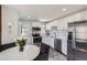 Modern kitchen with stainless steel appliances, white cabinetry, and stylish finishes at 2625 S Linley Ct, Denver, CO 80219