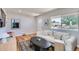 Inviting living room with large window, plush sofa, and stylish decor at 2625 S Linley Ct, Denver, CO 80219