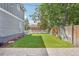 Inviting backyard with a well-manicured lawn and a charming white picket fence, perfect for outdoor relaxation at 4603 W 33Rd Ave, Denver, CO 80212
