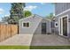 Backyard featuring a detached garage with string lights and a wooden fence at 4603 W 33Rd Ave, Denver, CO 80212