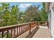 Wooden balcony overlooking mature trees and a residential street at 4603 W 33Rd Ave, Denver, CO 80212