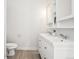 Bathroom featuring a double vanity with modern faucets and ample storage at 4603 W 33Rd Ave, Denver, CO 80212