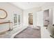Bright bedroom with access to balcony and adjoining bathroom, boasting a modern aesthetic at 4603 W 33Rd Ave, Denver, CO 80212