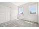 Bright bedroom featuring a sliding closet door and plenty of natural light at 4603 W 33Rd Ave, Denver, CO 80212