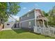 Charming two-story home with a well-manicured lawn and a white picket fence at 4603 W 33Rd Ave, Denver, CO 80212