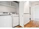 Convenient laundry room with modern washer and dryer, plus storage shelves at 4603 W 33Rd Ave, Denver, CO 80212