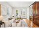 Bright living room with hardwood floors, a comfortable sofa, stylish decor, and a glass-paneled front door at 4603 W 33Rd Ave, Denver, CO 80212